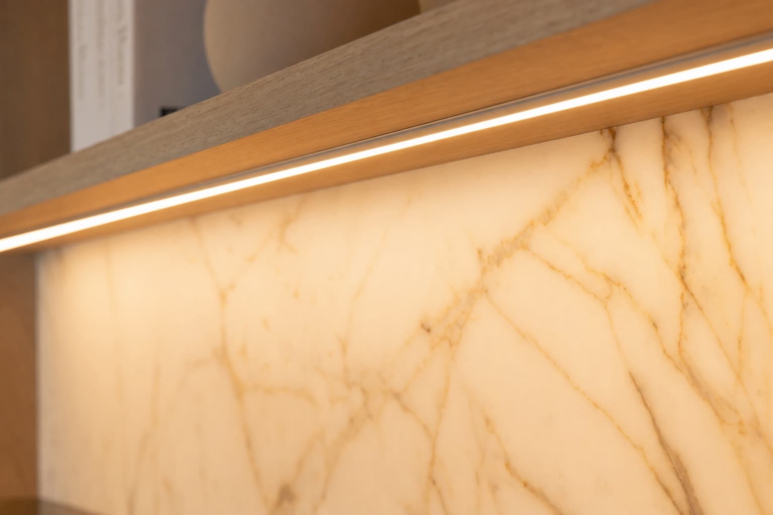 Side-by-side comparison of bin-matched LED and generic strip lighting on a media wall
