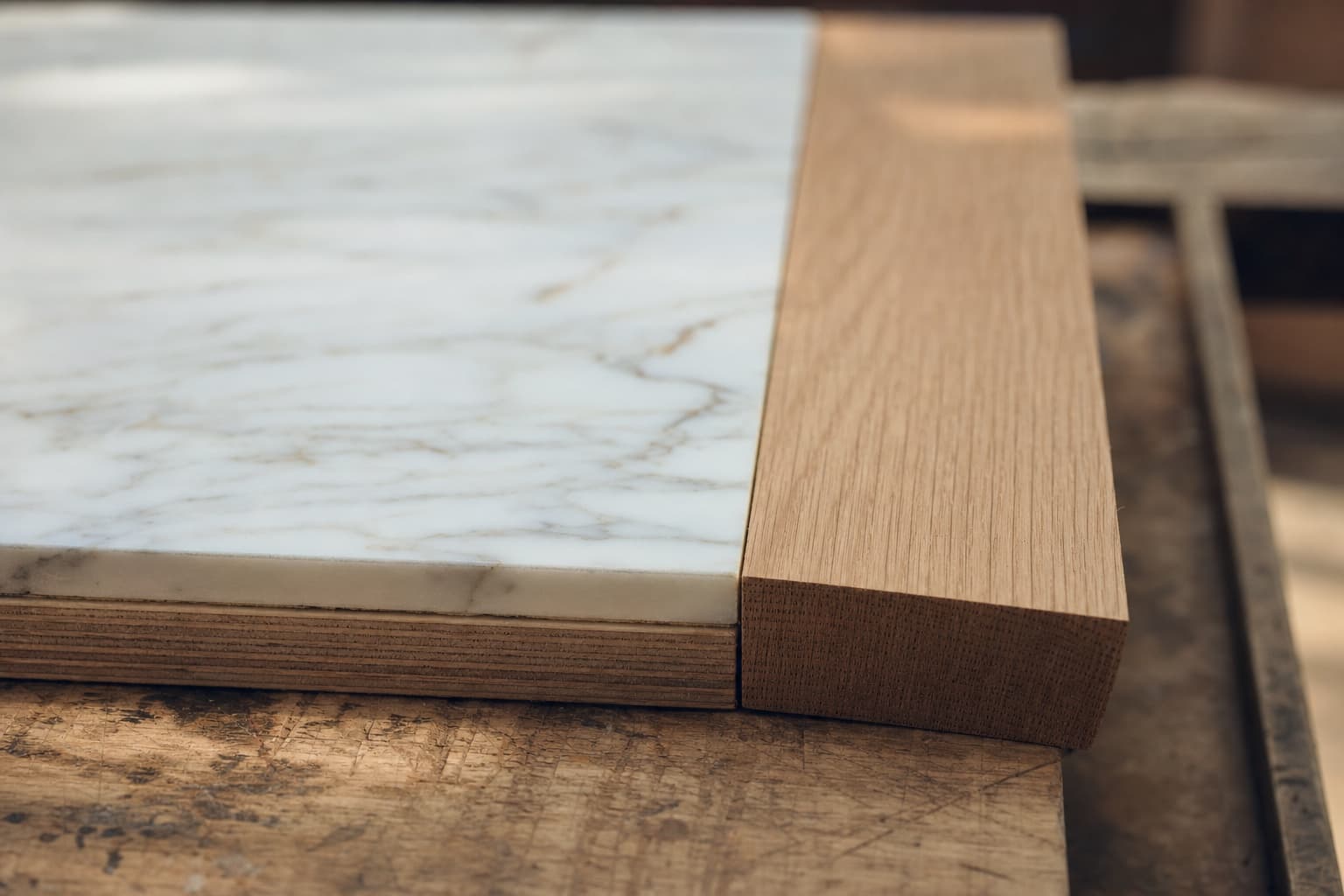 Premium stained wood veneer next to a real marble slab and a bin-matched LED strip